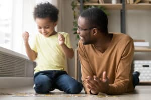 Dad and child playing with a puzzle