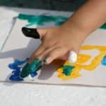 child finger painting