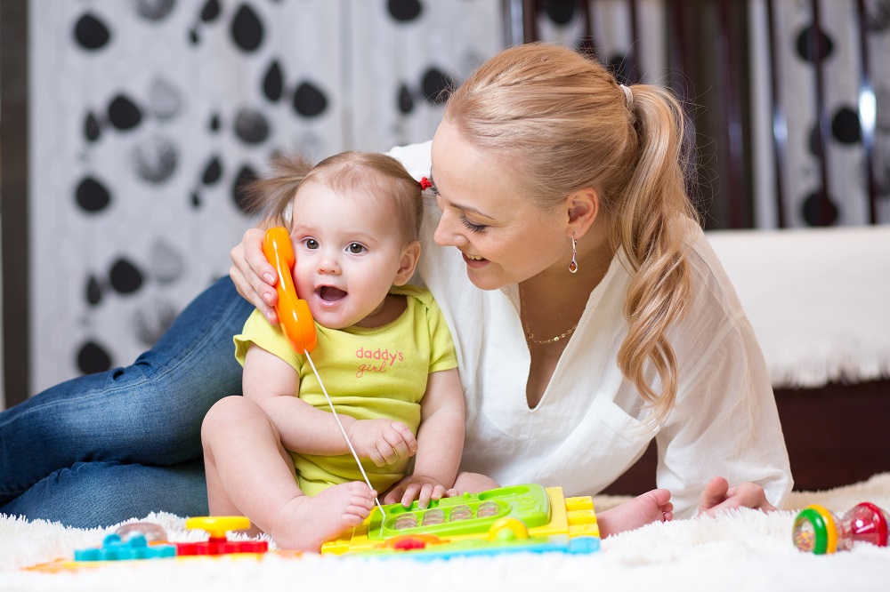 child girl phone with mother playing with toy phone