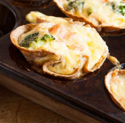 mini vegetable quiches made with wraps in a muffin tin